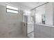 Elegant walk-in shower with glass enclosure and stylish tile work, leading to the bathroom at 4971 Oyster Pearl St, Bradenton, FL 34211
