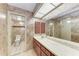 Full bathroom with tile flooring, marble countertop, and designer wallpaper at 5109 28Th W St, Bradenton, FL 34207