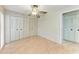 Bedroom featuring wood-look flooring, a ceiling fan, and spacious closet at 5109 28Th W St, Bradenton, FL 34207