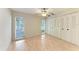 Bedroom features wood-look flooring, a ceiling fan, and bright, double-hung windows at 5109 28Th W St, Bradenton, FL 34207