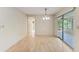 Light and bright dining room with wood floors and sliding door to sunroom at 5109 28Th W St, Bradenton, FL 34207