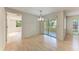 Dining room featuring wood floors and sliding doors to a screened-in patio at 5109 28Th W St, Bradenton, FL 34207