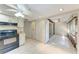 Bright kitchen featuring tile floors, white cabinets, and an adjoining sunroom at 5109 28Th W St, Bradenton, FL 34207