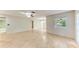 Expansive living room showcasing wood floors and multiple entryways at 5109 28Th W St, Bradenton, FL 34207