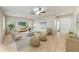 Bright living room with stylish furnishings, neutral colors, and wood-look flooring for a modern aesthetic at 5109 28Th W St, Bradenton, FL 34207