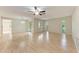 Spacious living room features wood floors, large windows, and a sliding glass door at 5109 28Th W St, Bradenton, FL 34207