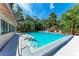 A beautiful community pool surrounded by palm trees and plenty of seating at 5109 28Th W St, Bradenton, FL 34207