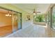A sunroom with large windows that brings in lots of natural light with a ceiling fan and tile floor at 5109 28Th W St, Bradenton, FL 34207