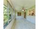 A sunroom with large windows, a ceiling fan, tile floors, and a view to the outside at 5109 28Th W St, Bradenton, FL 34207