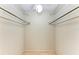 Open walk-in closet with hardwood flooring and wrap-around metal shelving at 5109 28Th W St, Bradenton, FL 34207