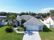 Aerial view of home showcasing its well-manicured lawn, landscaping, and a spacious driveway at 5110 19Th W Ave, Bradenton, FL 34209