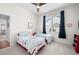 Bright bedroom featuring two twin beds with colorful chevron patterned bedding and a ceiling fan at 5110 19Th W Ave, Bradenton, FL 34209