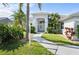Inviting front entrance with manicured landscaping, featuring a light gray facade and glass double doors at 5110 19Th W Ave, Bradenton, FL 34209