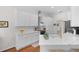 Modern kitchen with white cabinets, quartz countertops, and stainless steel appliances, perfect for culinary enthusiasts at 5110 19Th W Ave, Bradenton, FL 34209