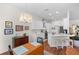Bright kitchen with white cabinets and a breakfast bar, seamlessly connecting to the adjacent dining area at 5110 19Th W Ave, Bradenton, FL 34209