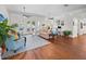 Spacious living room with hardwood floors, ceiling fans, and abundant natural light, offering a welcoming atmosphere at 5110 19Th W Ave, Bradenton, FL 34209