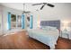 Spacious bedroom with hardwood floors, ceiling fans, and ample natural light at 5110 19Th W Ave, Bradenton, FL 34209