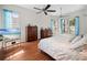 Spacious bedroom with hardwood floors, ceiling fans, and ample natural light at 5110 19Th W Ave, Bradenton, FL 34209