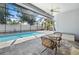 Relaxing screened-in pool area with comfortable seating, perfect for outdoor entertaining and enjoying the Florida sunshine at 5110 19Th W Ave, Bradenton, FL 34209