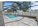 Screened-in pool area with brick pavers, lounge chairs, and white privacy fence at 5110 19Th W Ave, Bradenton, FL 34209