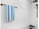 Contemporary shower features white textured tile, matte black hardware, and a corner shelf at 5110 19Th W Ave, Bradenton, FL 34209