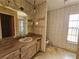 Full bathroom with vintage wallpaper and fixtures at 5114 36Th Avenue W Dr, Bradenton, FL 34209