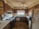 Galley kitchen with outdated appliances and countertops at 5114 36Th Avenue W Dr, Bradenton, FL 34209