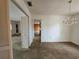 Wide view of a living room with outdated flooring at 5114 36Th Avenue W Dr, Bradenton, FL 34209