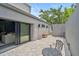 Private backyard features stylish pavers, mature trees, and a contemporary design perfect for outdoor living at 512 Treasure Boat Way, Sarasota, FL 34242