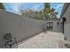 Secluded backyard with patterned pavers, a minimalist aesthetic, and ample space for outdoor entertaining at 512 Treasure Boat Way, Sarasota, FL 34242