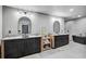 Modern bathroom featuring double vanities, sleek fixtures, mirrors, and a soaking tub at 512 Treasure Boat Way, Sarasota, FL 34242