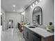 Bright bathroom featuring double vanities, sleek mirrors, and modern finishes at 512 Treasure Boat Way, Sarasota, FL 34242
