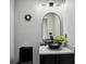 Modern bathroom with a unique black vessel sink and stylish lighting fixtures at 512 Treasure Boat Way, Sarasota, FL 34242