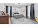 Cozy bedroom with hardwood floors, soft rug, and accent lighting at 512 Treasure Boat Way, Sarasota, FL 34242
