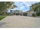 Stunning modern home with a spacious paver driveway and lush landscaping in a sought-after neighborhood at 512 Treasure Boat Way, Sarasota, FL 34242
