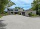 Stunning modern home boasting a spacious driveway and lush landscaping in a sought-after neighborhood at 512 Treasure Boat Way, Sarasota, FL 34242