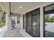Close-up of modern double front doors, showcasing the home's stylish entrance and inviting curb appeal at 512 Treasure Boat Way, Sarasota, FL 34242