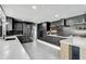 Elegant kitchen featuring dark cabinetry, stainless steel appliances, and ample counter space at 512 Treasure Boat Way, Sarasota, FL 34242