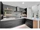 Modern kitchen with custom cabinetry, a stylish backsplash, and ample counter space for cooking at 512 Treasure Boat Way, Sarasota, FL 34242