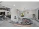 Bright living room showcasing sunken circular sofa, fireplace, and modern design at 512 Treasure Boat Way, Sarasota, FL 34242