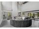 Expansive living area featuring a statement fireplace, comfortable seating, and seamless transition to dining at 512 Treasure Boat Way, Sarasota, FL 34242
