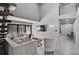 Bright, open living room showcases high ceilings, large sliding doors, and a comfortable seating arrangement at 512 Treasure Boat Way, Sarasota, FL 34242