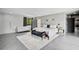 Bright main bedroom featuring a sitting area, sleek finishes, and ample space at 512 Treasure Boat Way, Sarasota, FL 34242