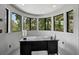 Bright office with ample natural light from curved windows and modern desk at 512 Treasure Boat Way, Sarasota, FL 34242