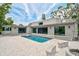 Inviting backyard pool and modern home with spacious patio, creating an idyllic outdoor living space at 512 Treasure Boat Way, Sarasota, FL 34242