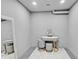 Contemporary vanity featuring a round mirror, drawers, stools, and gold accents at 512 Treasure Boat Way, Sarasota, FL 34242