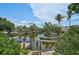 Picturesque waterfront view with lush greenery and private dock access, perfect for boating enthusiasts at 512 Treasure Boat Way, Sarasota, FL 34242
