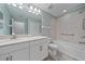 Clean bathroom featuring a white vanity with bathtub-shower combination at 5191 78Th St E Cir, Bradenton, FL 34203