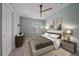 Bright bedroom featuring a ceiling fan, window and neutral decor at 5191 78Th St E Cir, Bradenton, FL 34203