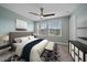 A well-lit main bedroom featuring a ceiling fan, two windows and a neutral color palette at 5191 78Th St E Cir, Bradenton, FL 34203